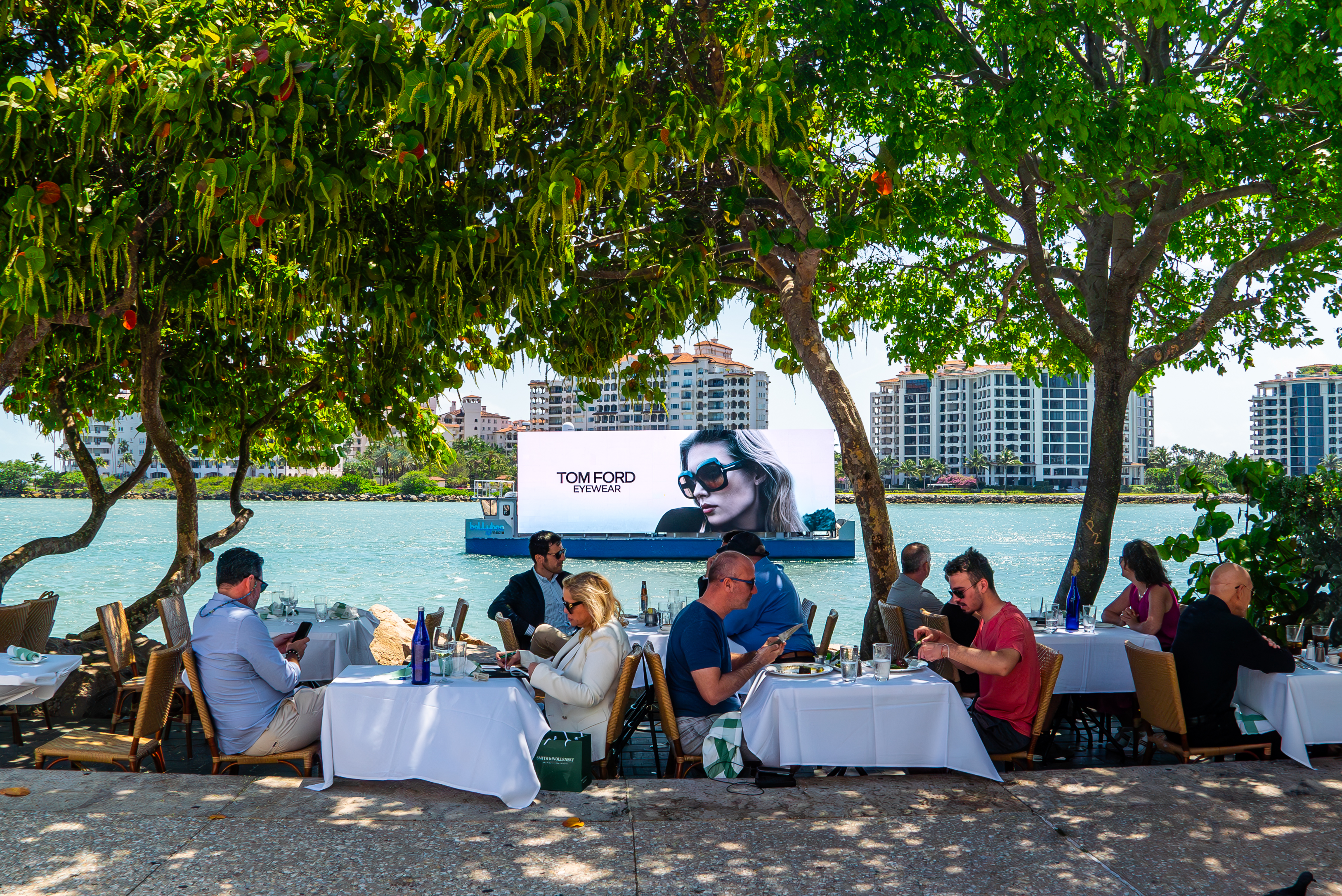 LED billboard boat advertising along a coastline